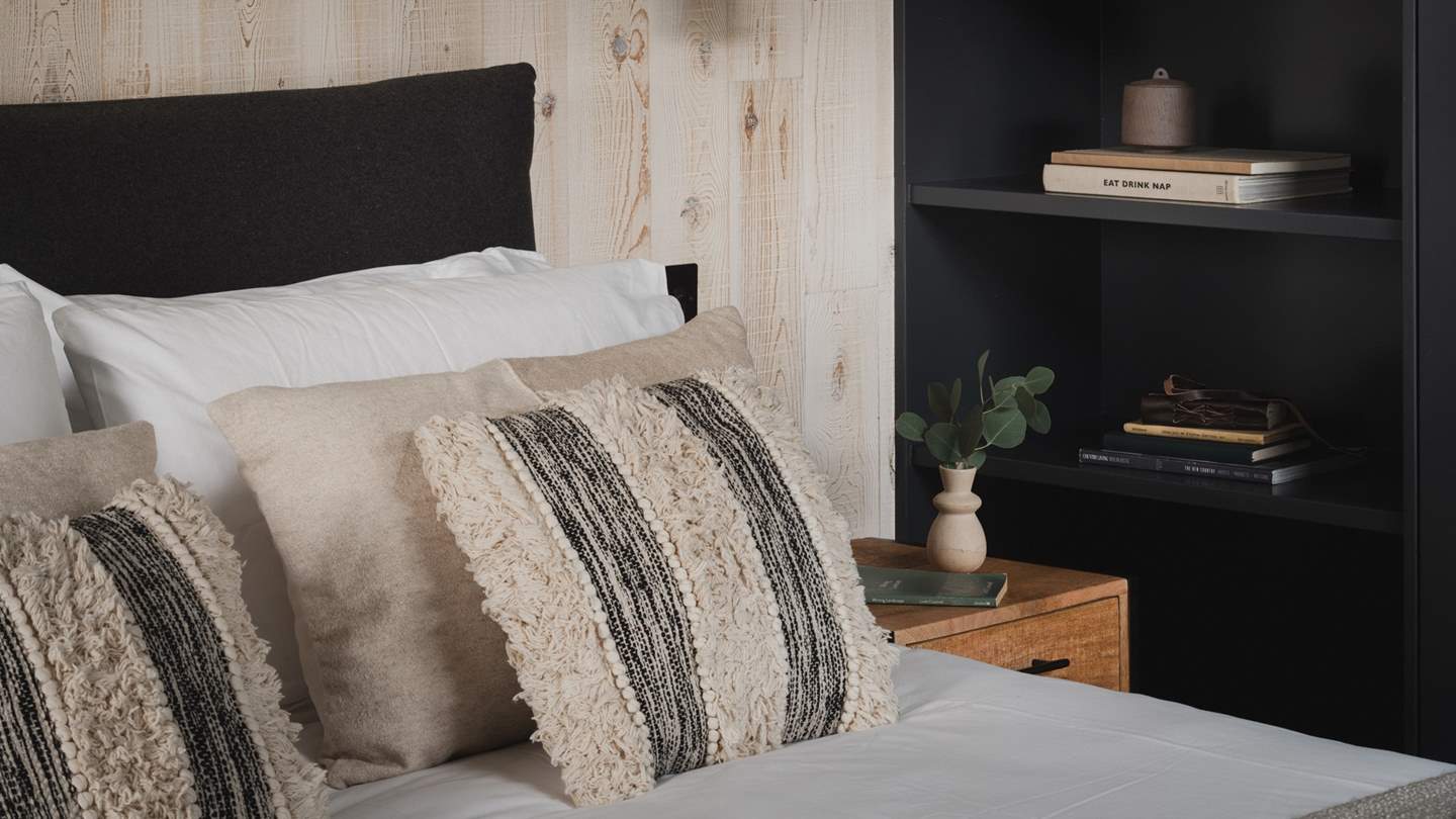 This bedroom features a sliding patio door for mornings caressed with a warm sea breeze

