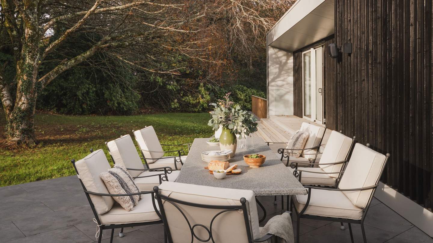 Perfect for family gatherings, a dining table with eight chairs resides in the east, made for brunches of local delights and grilled repasts on the gas barbecue