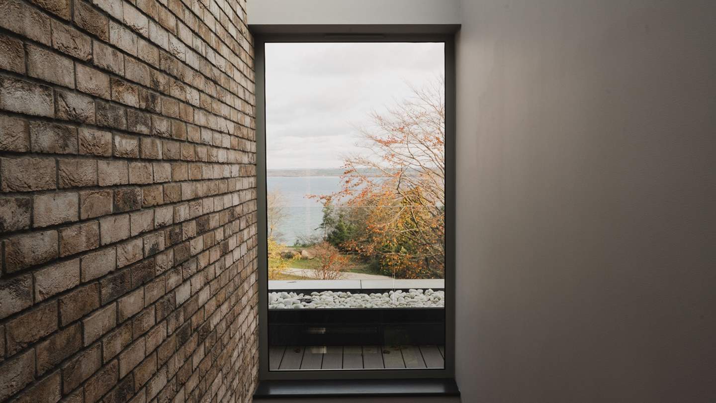 An enchanting escape for getaways with family and friends, five elegant bedrooms and stunning living spaces reside across three floors