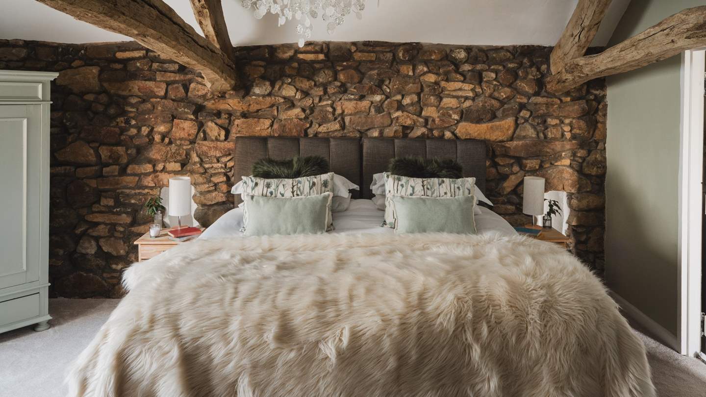 A charming zip-and-link super-king bed resides on the first floor, offering flexible sleeping for two