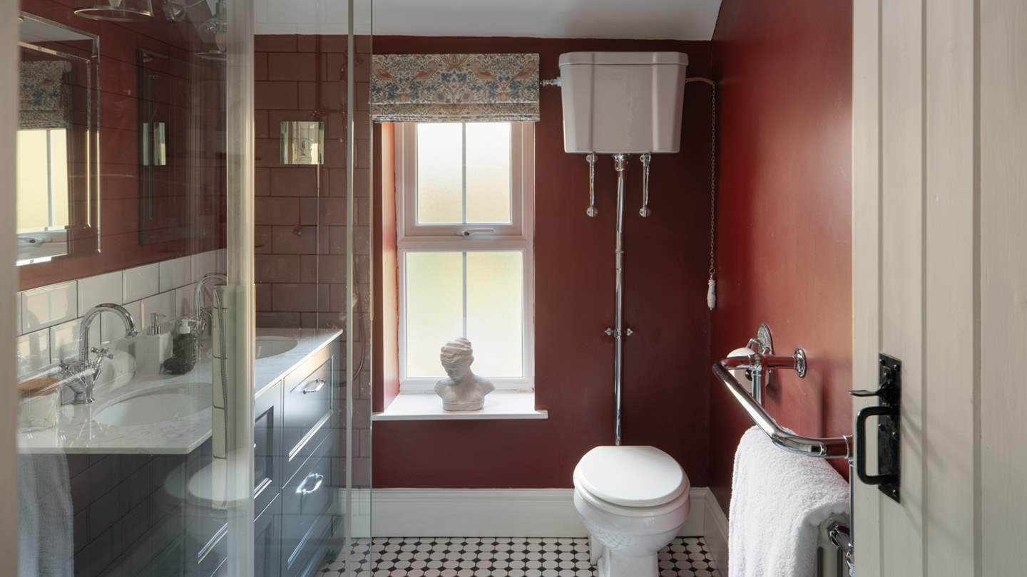 Nestled beside the dressing space is the luxurious shower room