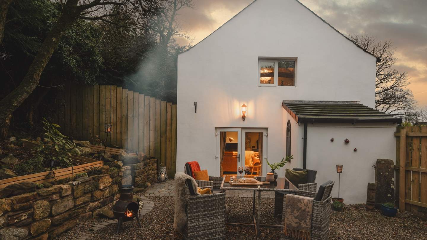 Patio doors lead onto an inviting private terrace, which is perfectly secure for dogs to roam