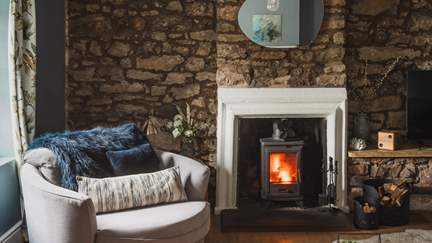 Bask in fireside moments by the crackling wood burning stove