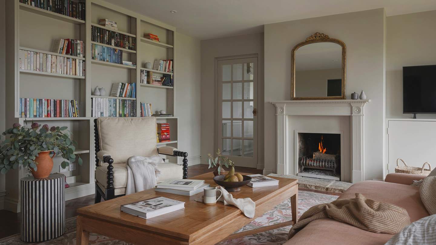 For evenings of fireside togetherness, find a formal living area on the ground floor where soothing tones and period details paint a beautiful scene
