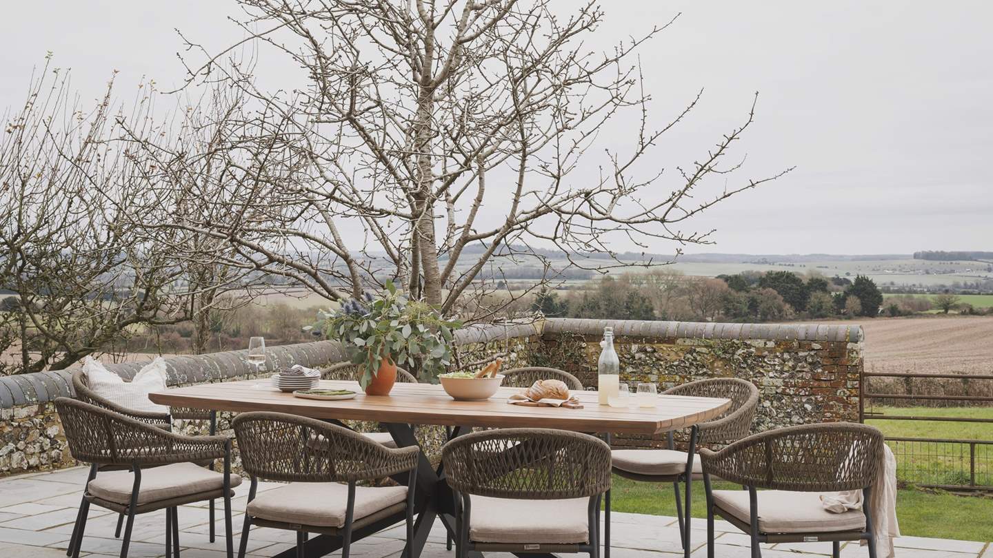 Lay the table with platters of artisan delights and pop corks as the golden hour sun casts dappled light through the trees