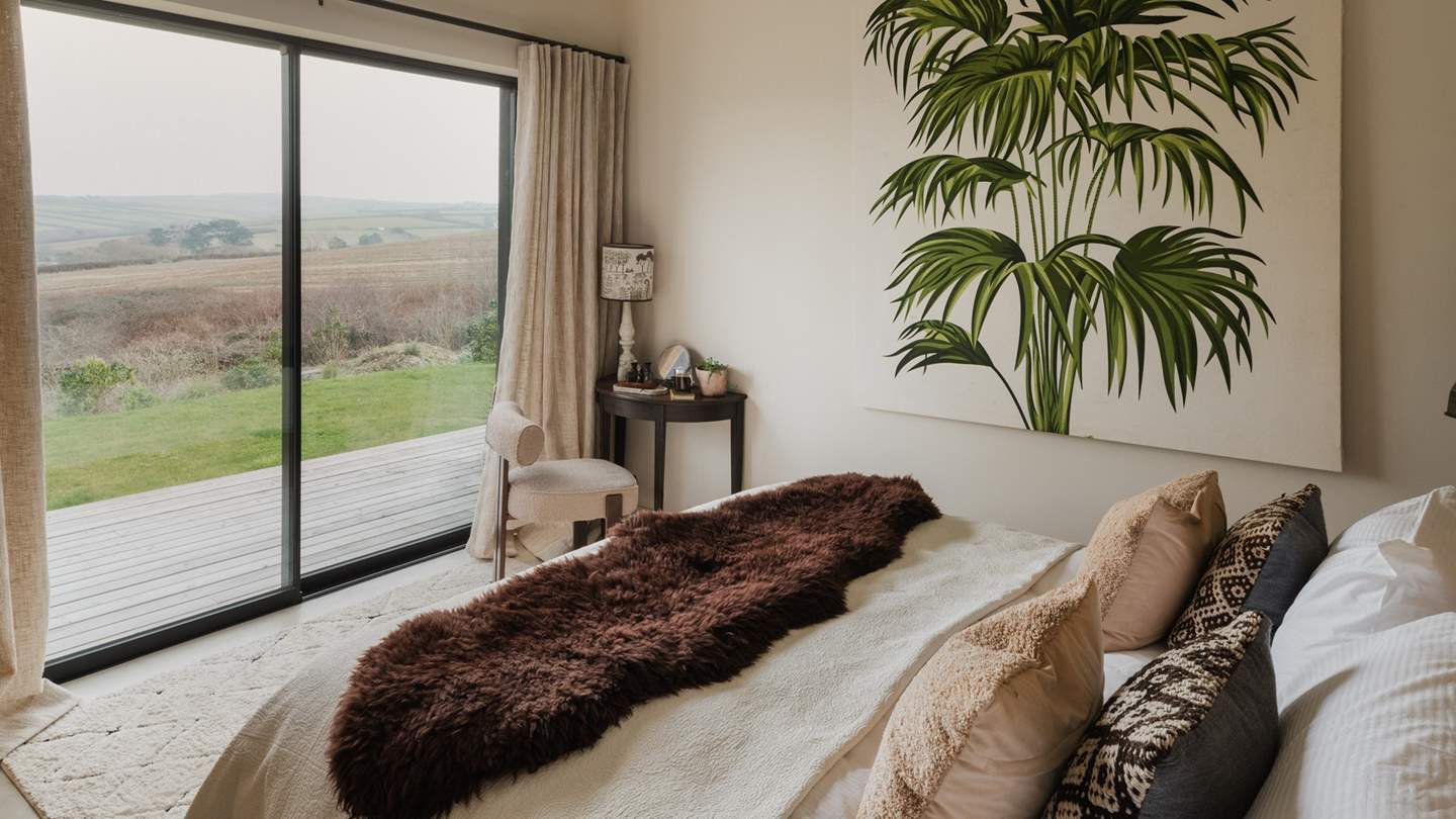 Settled on the ground floor is the Family Room, endlessly inviting with creamy hues and a super-king wooden bed topped with cosy throws