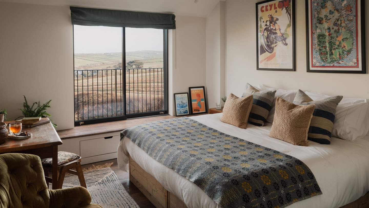 Along the corridor, discover another peaceful bedroom, adorned in nostalgic artwork