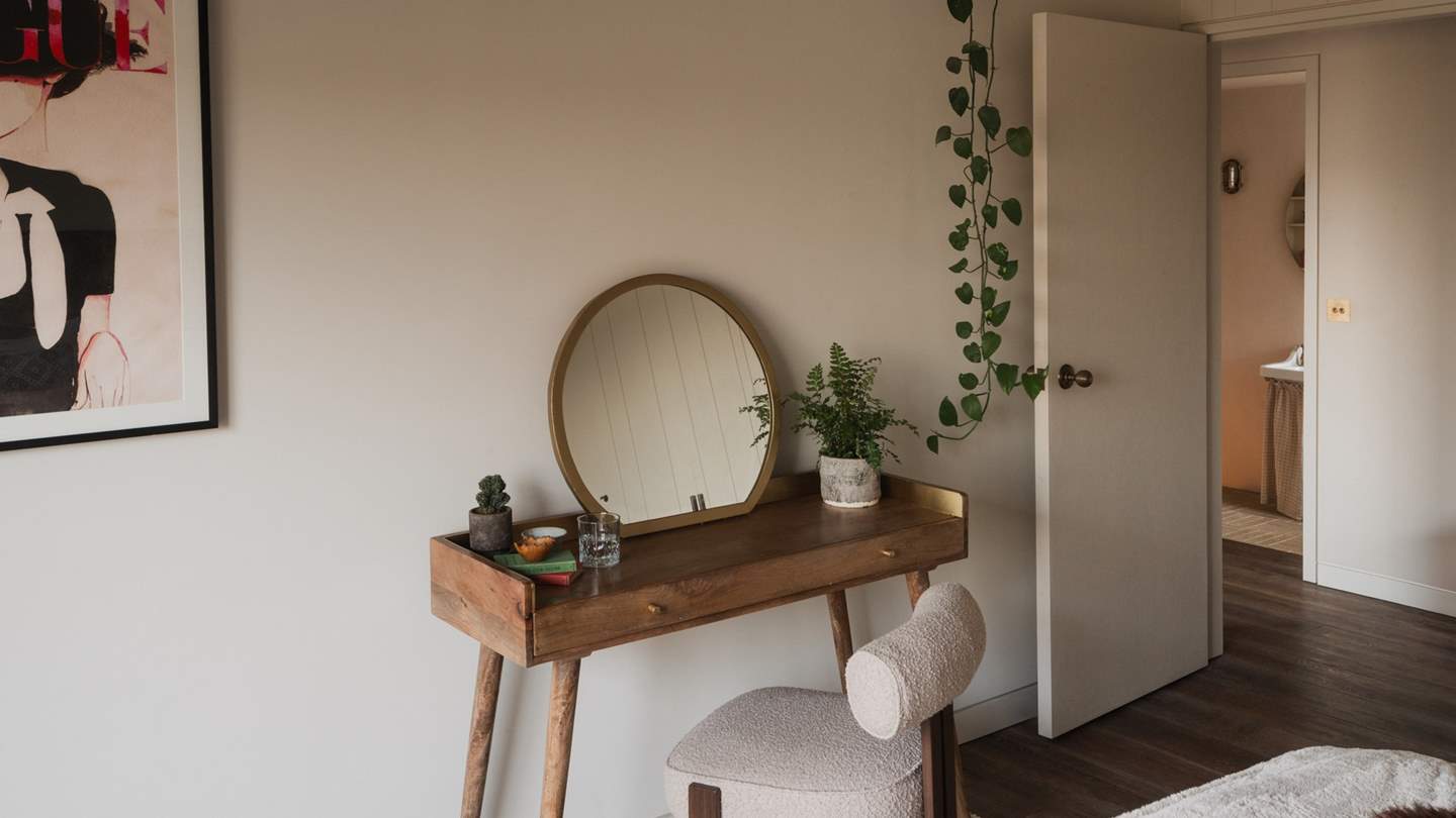 Discover a small writing desk with a boucle chair for chronicling travel reveries