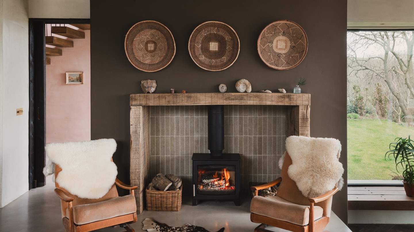 Stretch out in style on the sheepskin draped wooden mid-century recliners