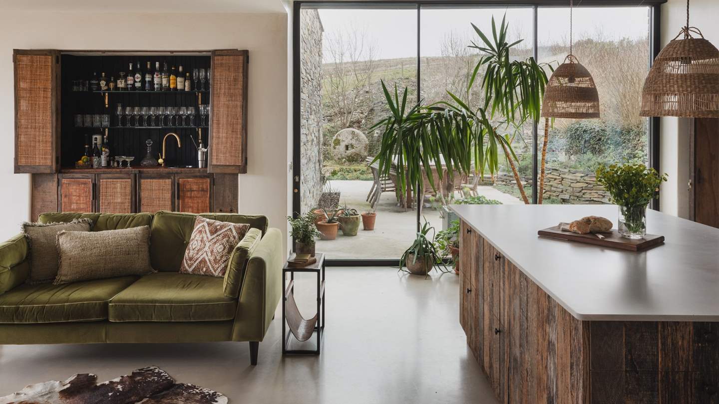 Discover the spacious open-plan living and dining quarters, adorned with Nahla's signature polished concrete floors