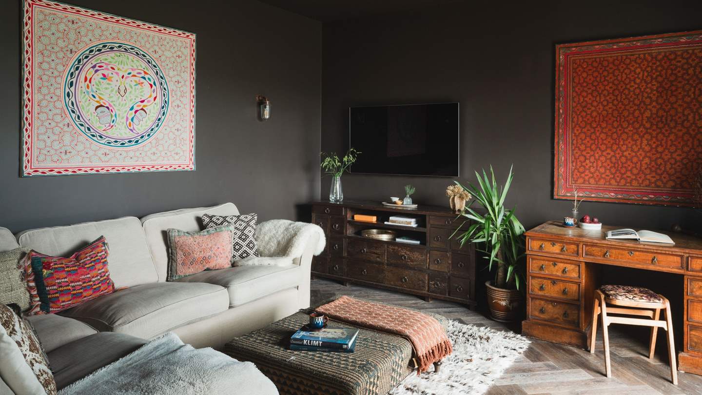 Endlessly cosy with chocolate-toned walls, there is a Smart TV and a gaming console for the little ones to enjoy