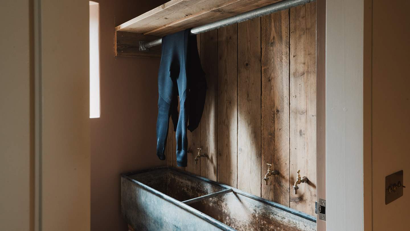 An indoor wet room is the perfect space to store beach equipment, rinsed via the outdoor tap 