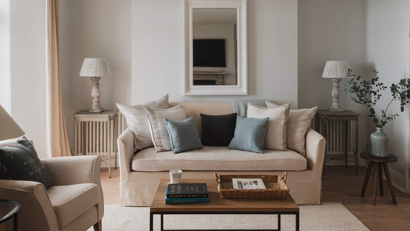 Settle into one of the four sumptuous armchairs or four-seater sofa by Neptune and bask in the soft light from French doors