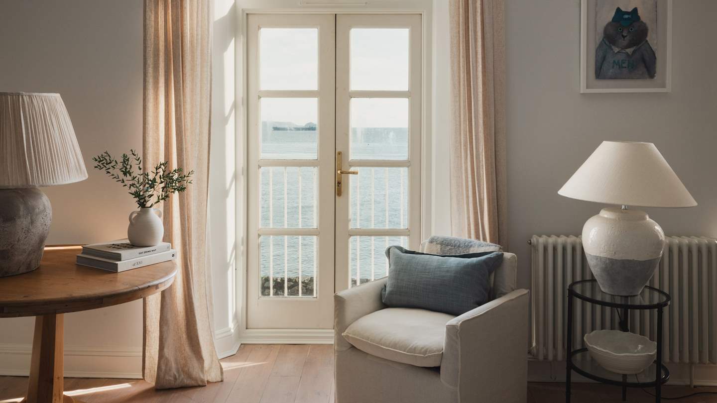 Exuding timeless charm antique console tables rest in cosy corners