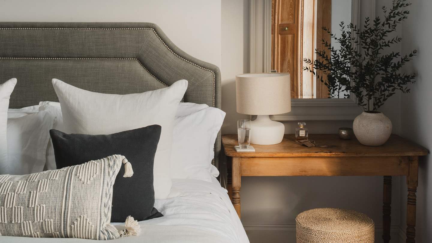 Providing space for belongings are built-in wardrobes and a dressing table