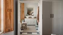 Step through the wardrobe into the secret marble ensuite bathroom, where peaceful pampering and a walk-in shower await