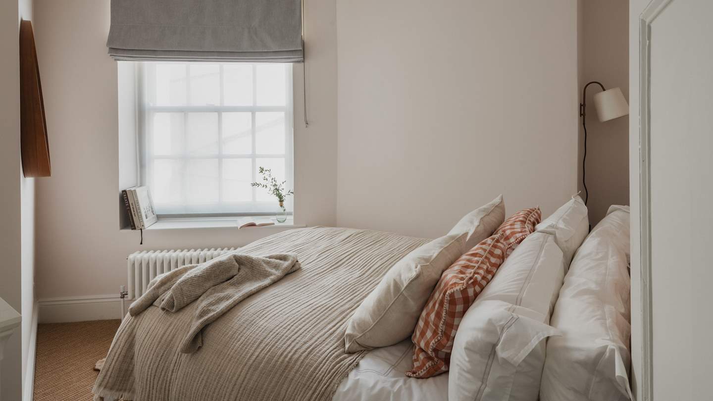 Enticing for heavenly repose, the second bedroom is home to a king-size Neptune bed draped in luxurious linens for nights of slumber