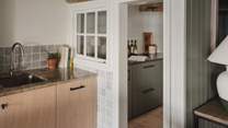 A separate pantry area provides plenty of space to store favourite fresh local produce for home-cooked feasts
