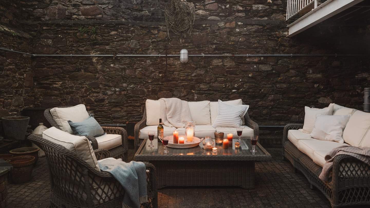 The courtyard garden is a magical spot for gathering over cocktails and conversation