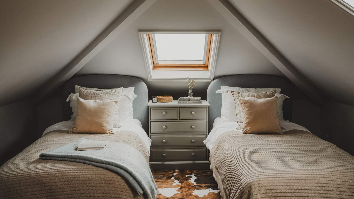 Completing the picture, the fourth bedroom is ideal for children or friends and can be found in the eaves with characterfully vaulted ceilings