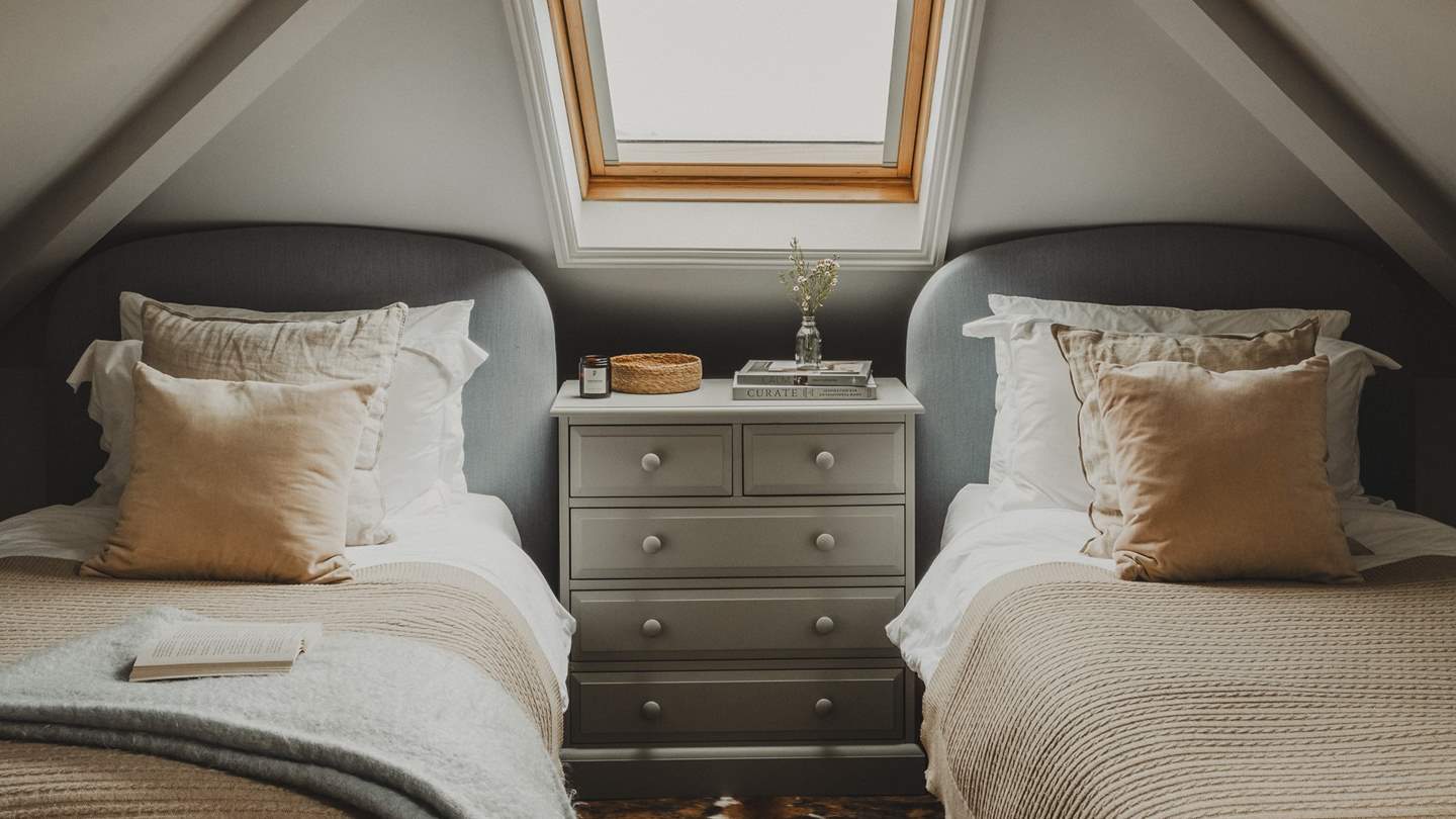 A charming room, it features twin beds topped with cloud-soft duvets, and also enjoys an ensuite bathroom