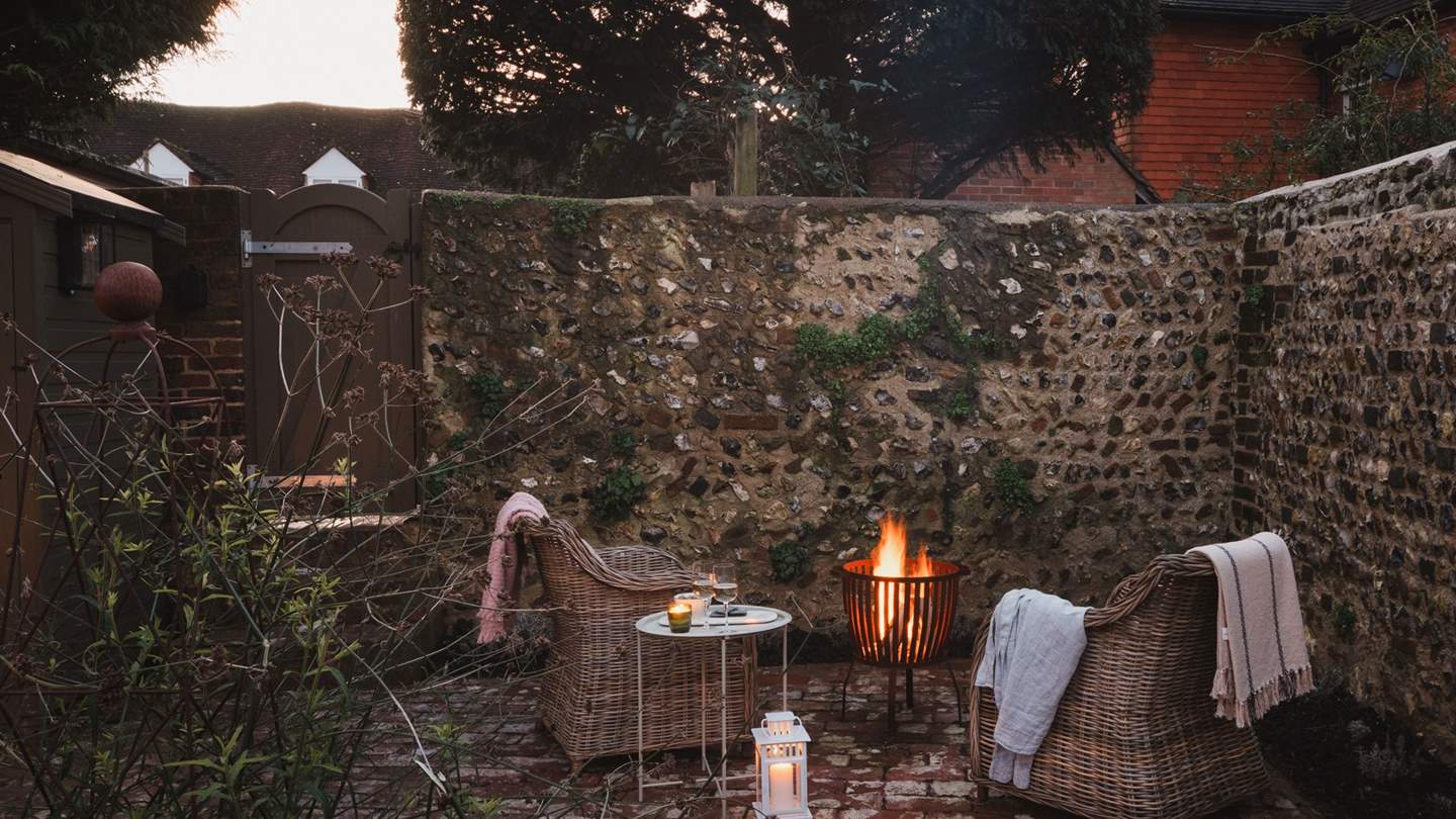 Cosy up beside the glow of the firepit...