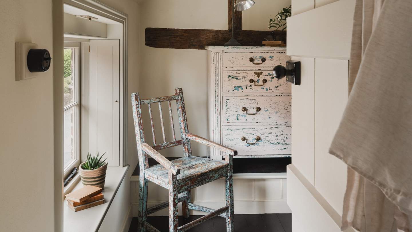 Antique details adorn the upstairs landing of our romantic cottage for two