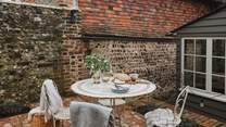 A dreamy space for sun-kissed brunches and starlit soirees, the courtyard garden is a heavenly scene with historic walls garlanded in leafy climbers