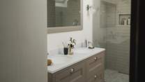 Beside the dual vanity sink, there is also a heated towel rail to keep towels fluffy and warm