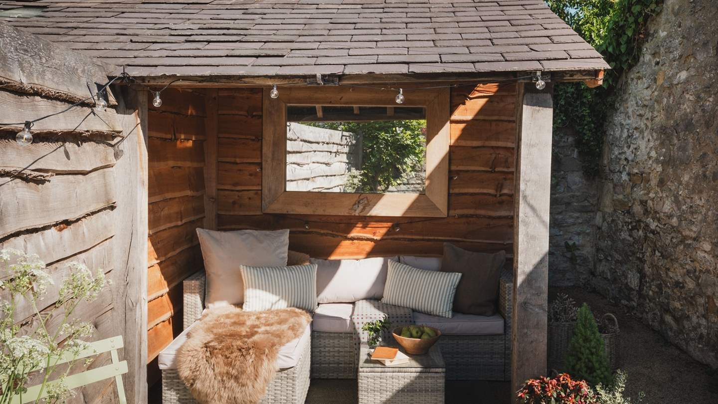 The sheltered seating space is perfect for shaded moments on sun dappled days
