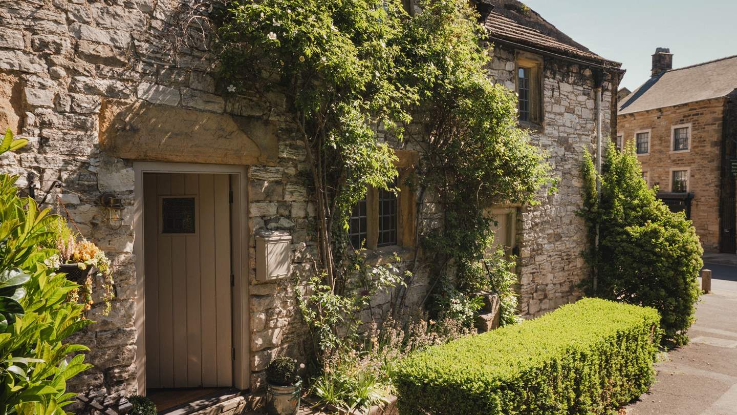 Climbing roses adorn the stone façade, promising a soul-soothing escape for lovers and solo-travellers alike