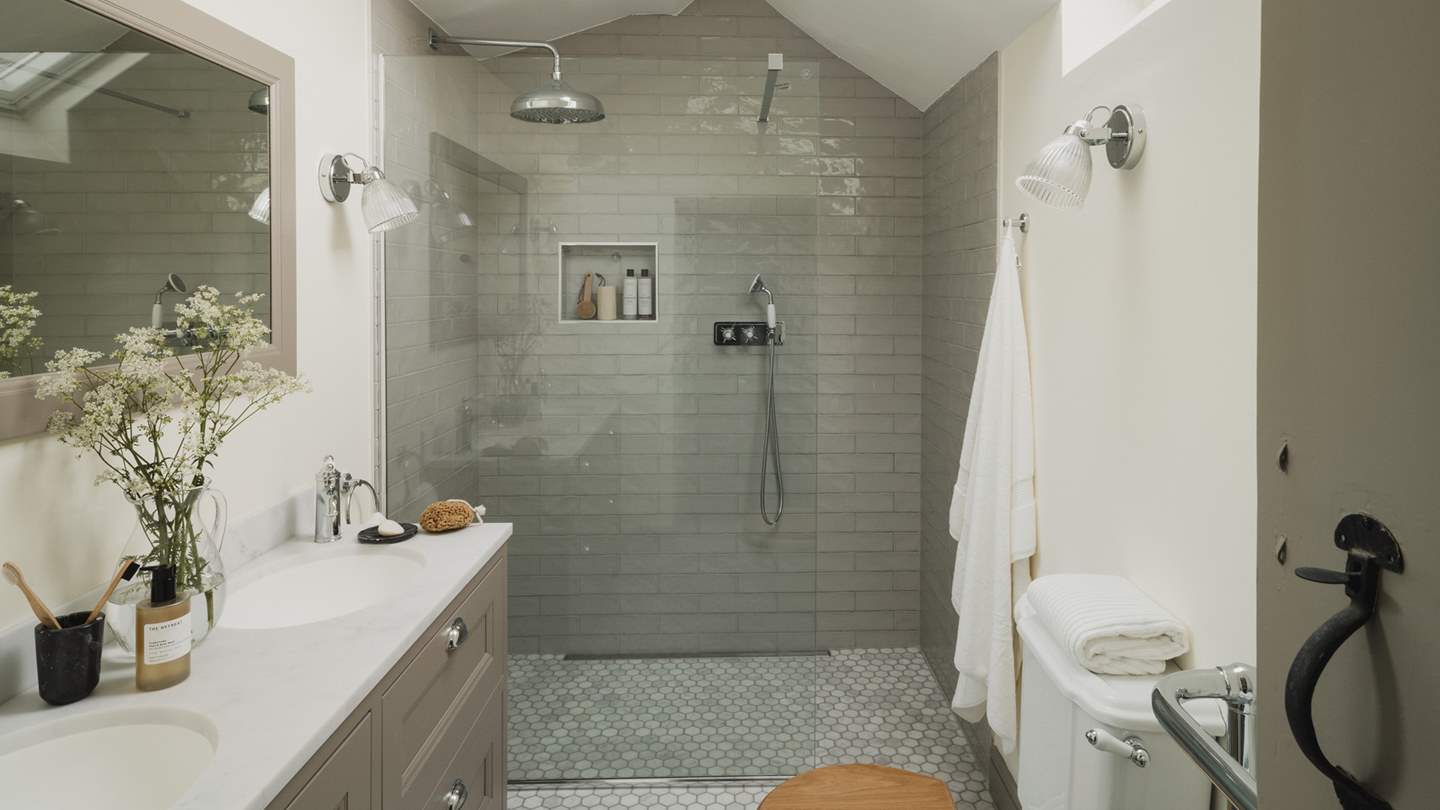 Beside the bedroom, lies the light-filled ensuite shower room, complete with a large walk-in shower 