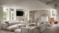 Relish cosy moments in the sunken seating area, with three sumptuous sofas in oatmeal hues centred around a rustic coffee table