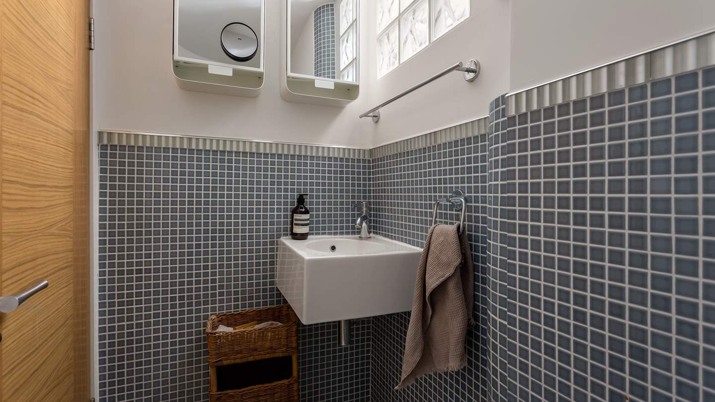 For added convenience, you’ll find an additional toilet room across from the two bedrooms