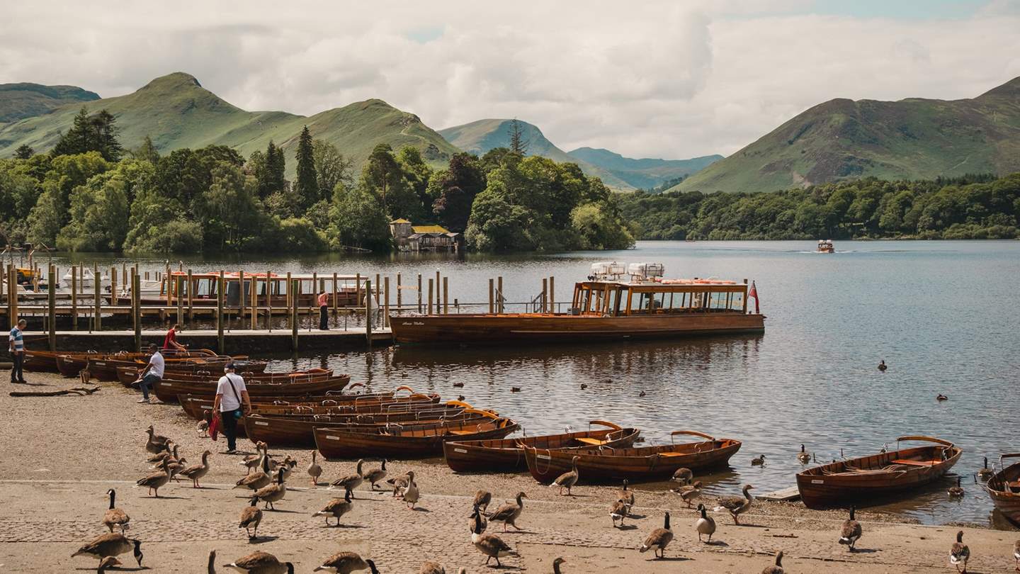 Hire a boat and sail around Derwentwater, exploring the secluded inlets and beaches
