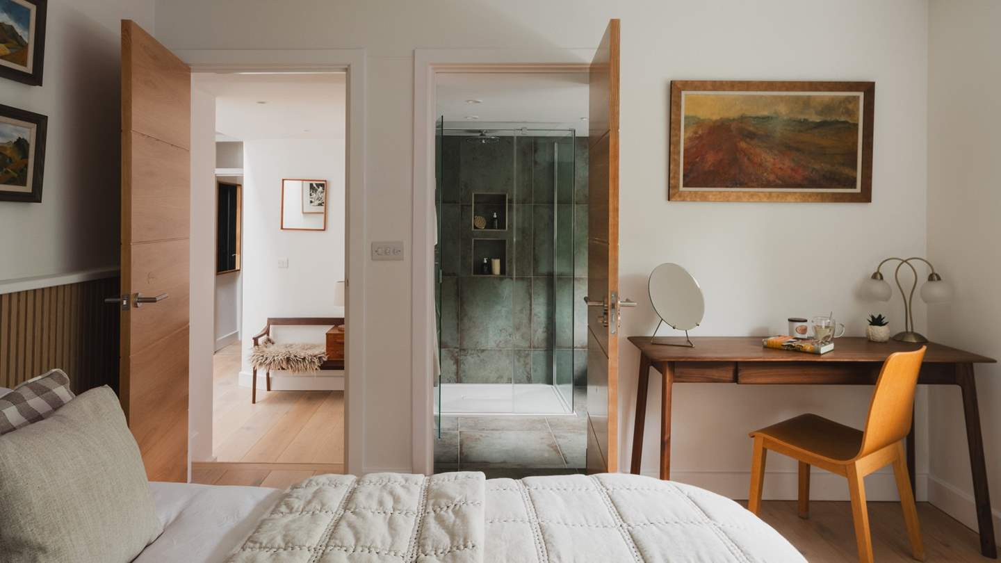 or storing belongings, you will find a wardrobe, and there’s a desk with a chair too