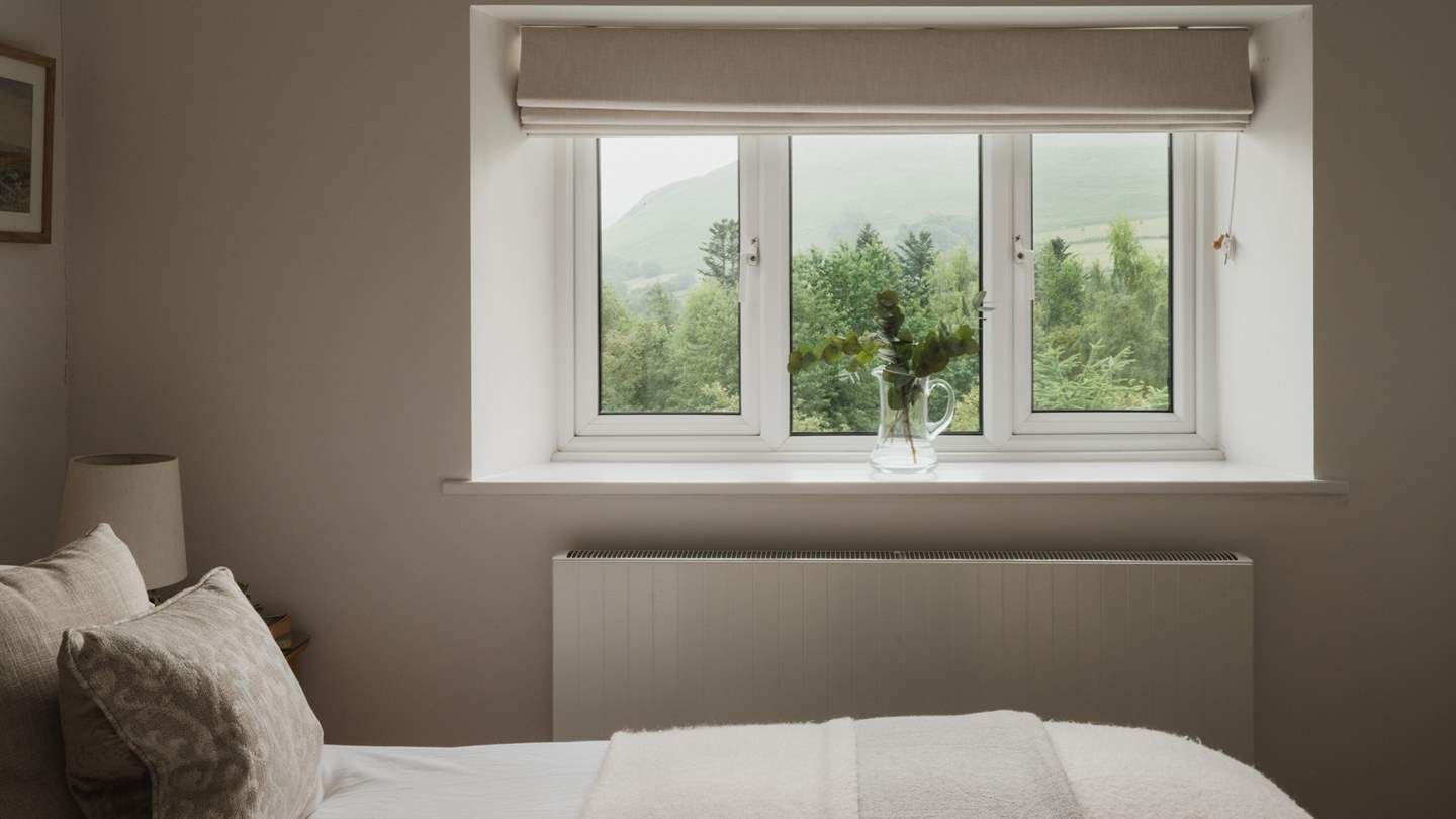 Behind the blinds, unveil awe-inspiring mountain views