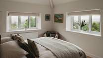 The second bedroom boasts heavenly Lakeland vistas from the dual aspect windows