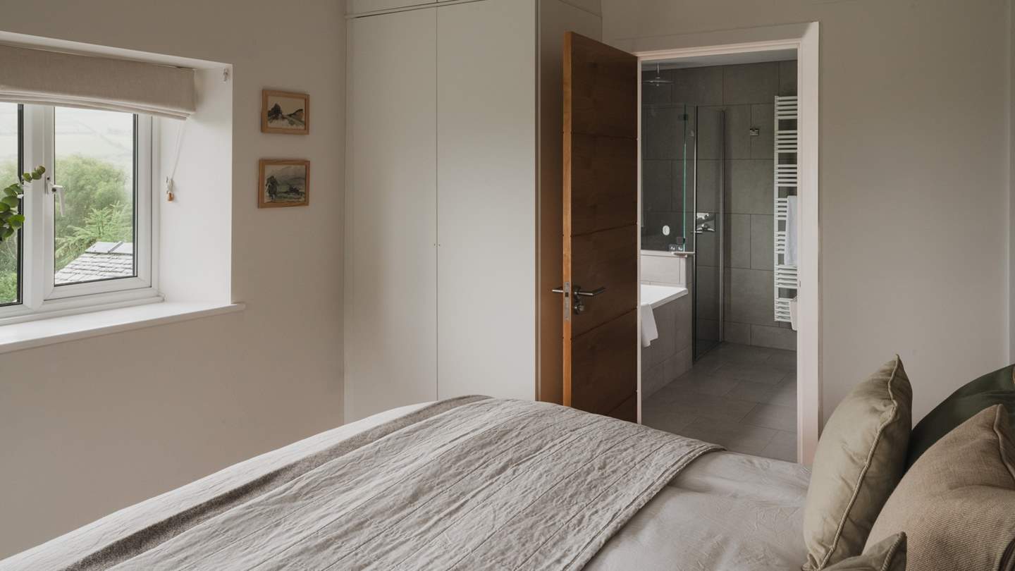 You'll find a built-in wardrobe for storage, plus an armchair for resting with a gripping novel