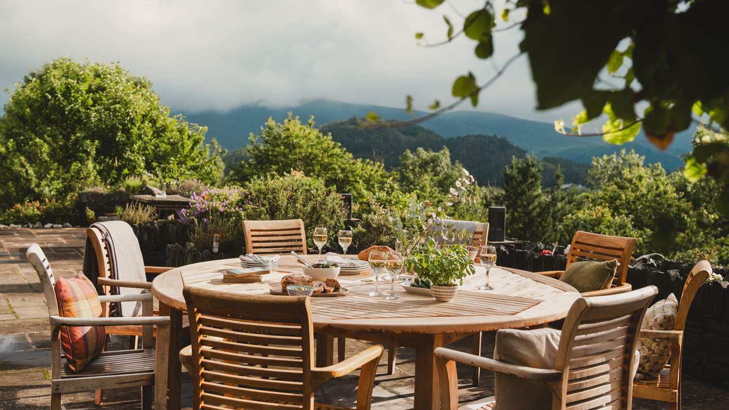 Enjoy alfresco feasts around the 12-seater outdoor dining table