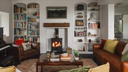 Uncover leather sofas, comfortable armchairs and a library
