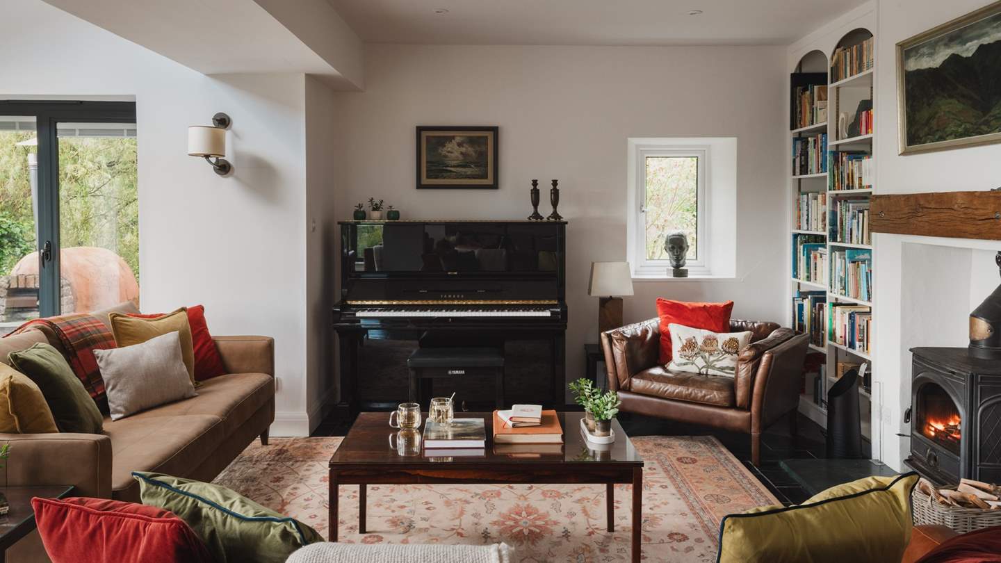 A Yamaha Upright piano awaits avid musicians