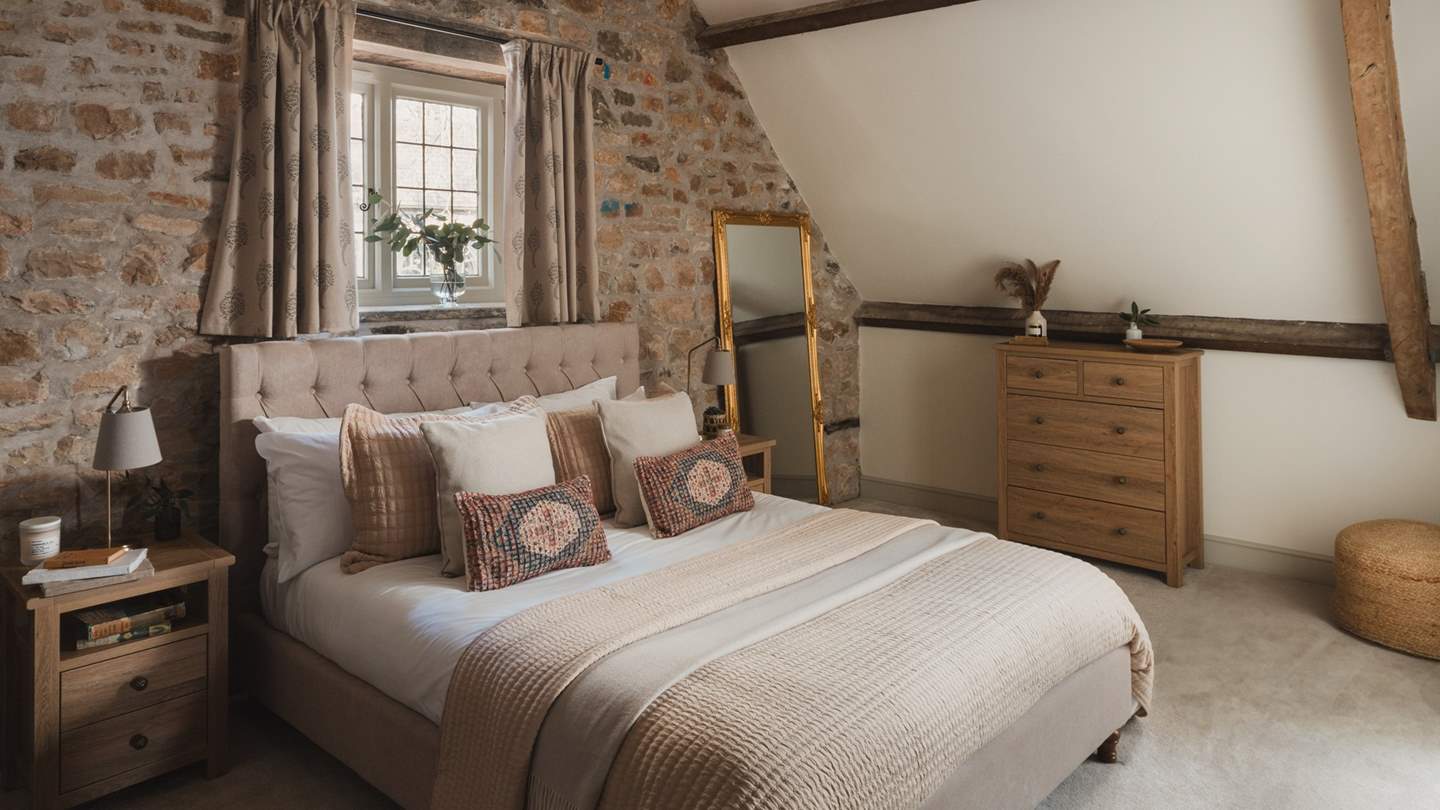 An indulgent king size bed is swathed in luxurious linens 