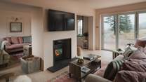 Relax fireside in front of the Smart TV, with the addition of an Xbox for younger party members 