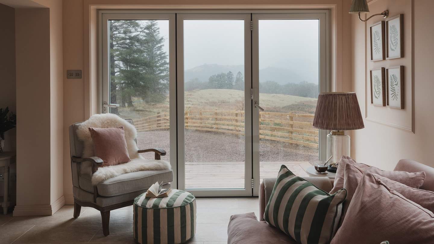 Bifold doors open onto a decked patio area for soaking up the sun in the warmer months