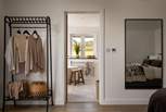 For storing your belongings, there are two bedside tables and a hanging rail