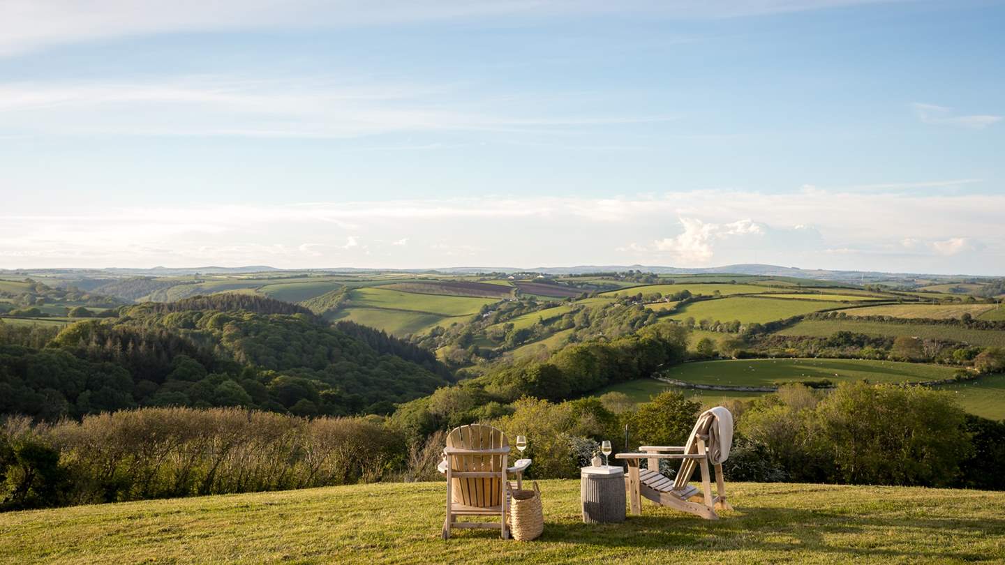An array of doors leading to the enchanting outdoor space and verdant valleys beyond