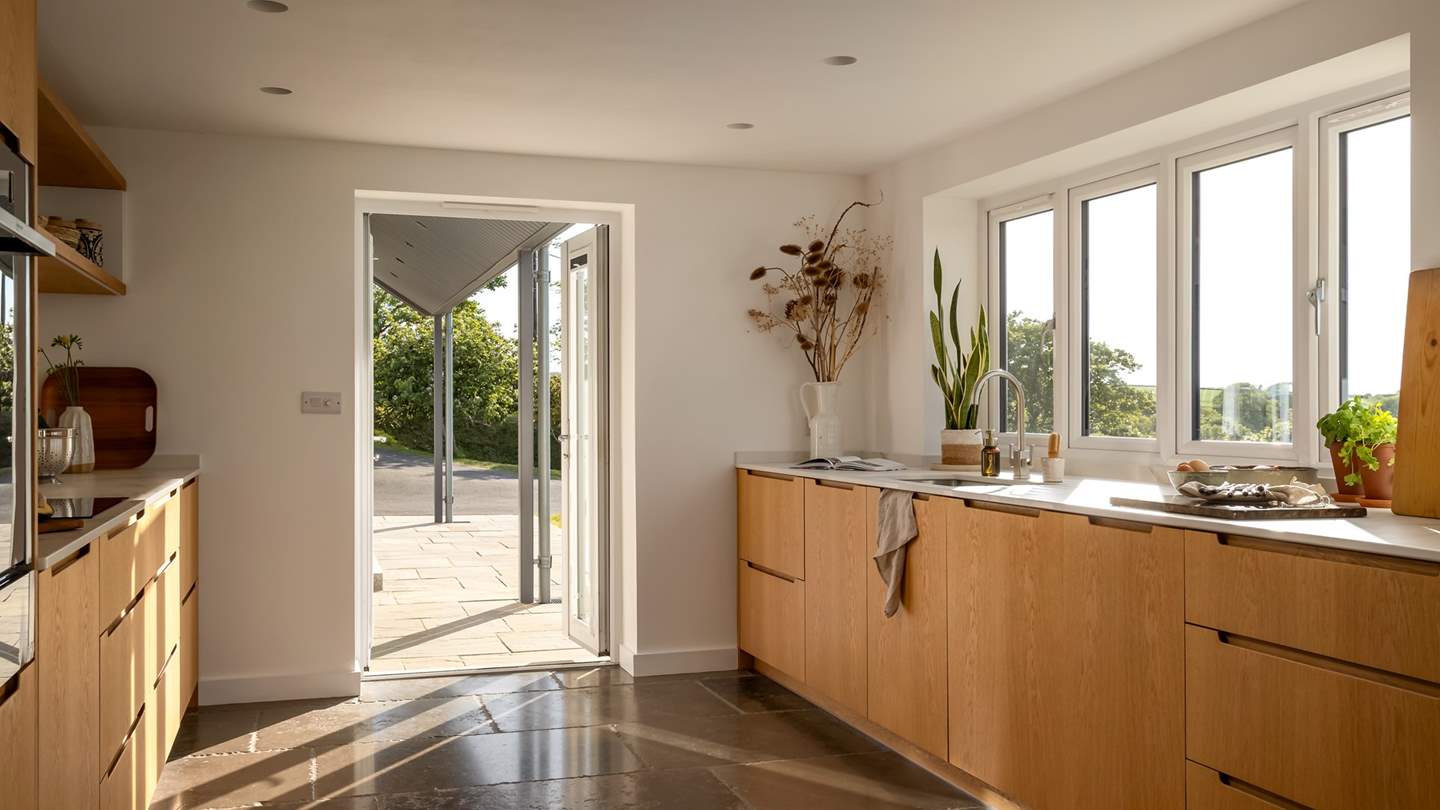 Earthy tones and natural materials reign in the light-filled kitchen
