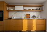 The bespoke wood kitchen invites for culinary creativity with your darling