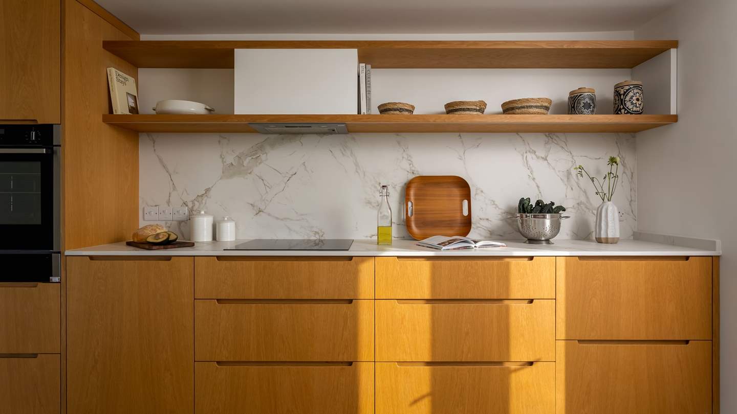 The bespoke wood kitchen invites for culinary creativity with your darling